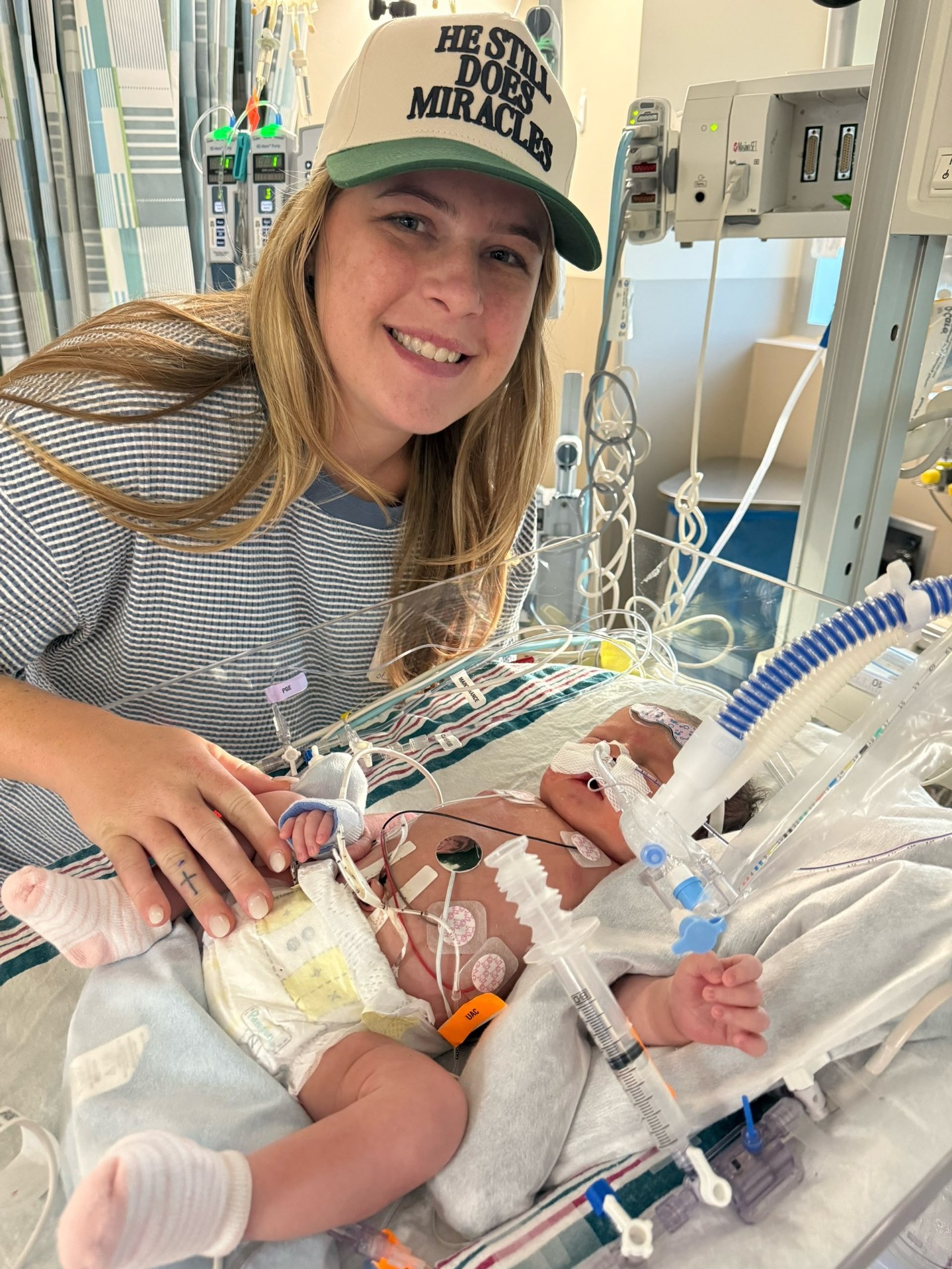 Alice's mother smiling at her bedside in the hospital